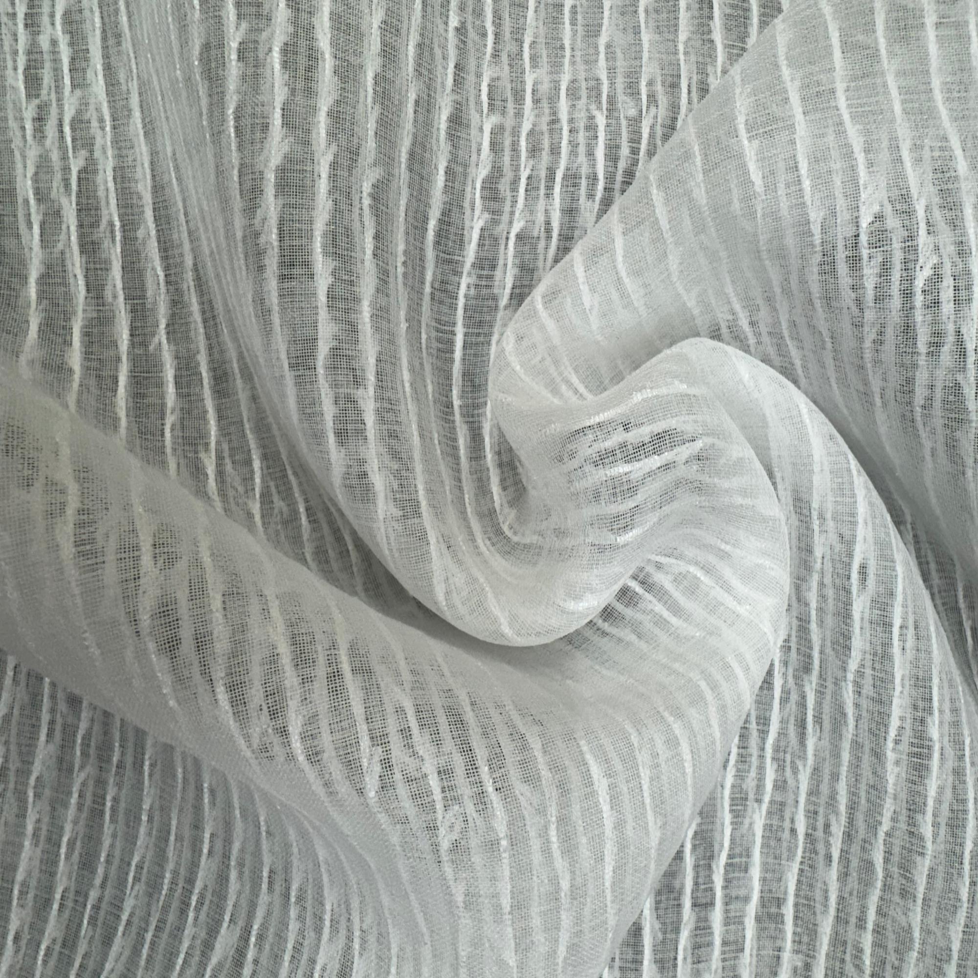 Close-up of sheer white fabric with a textured pattern
