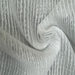 Close-up of sheer white fabric with a textured pattern