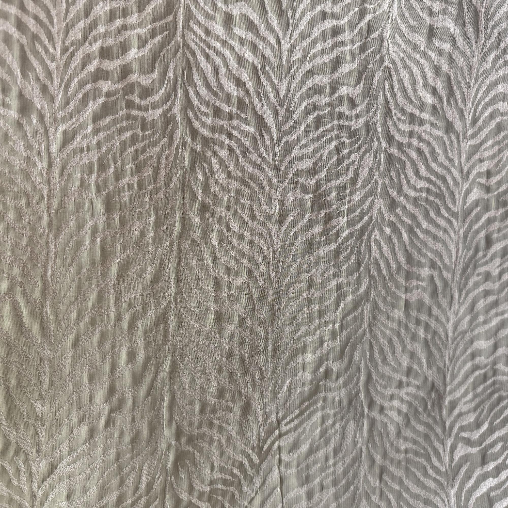 Textured fabric with a zebra stripe pattern in gray tones