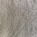 Textured fabric with a zebra stripe pattern in gray tones