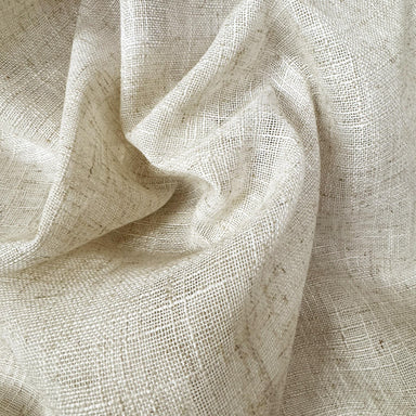 Natural lightweight sheer fabric with a refined texture, ideal for curtains and drapery. High-quality and stylish for any space.