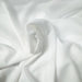 Ivory lightweight sheer fabric with a refined texture, ideal for curtains and drapery. High-quality and stylish for any space.