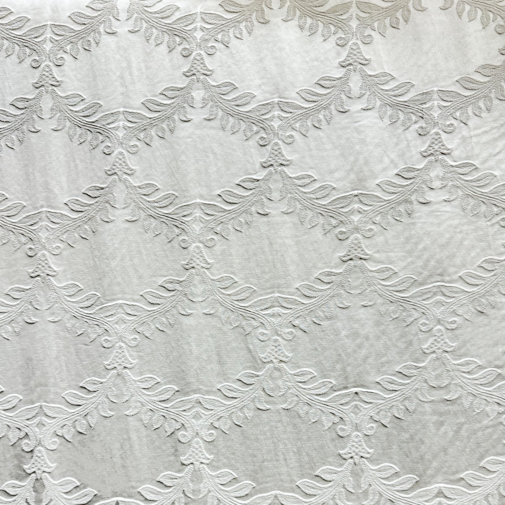 Diamond fabric in color White showcasing fabric embossed floral diamond shape upholstery fabric & drapery & curtain fabric.