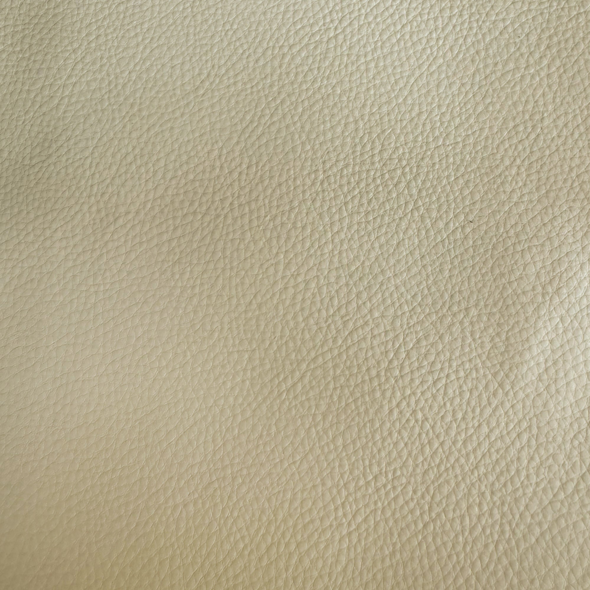 Pelle fabric in color Cream showcasing fabric solid faux leather upholstery fabric.