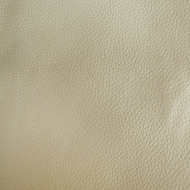 Pelle fabric in color Cream showcasing fabric solid faux leather upholstery fabric.
