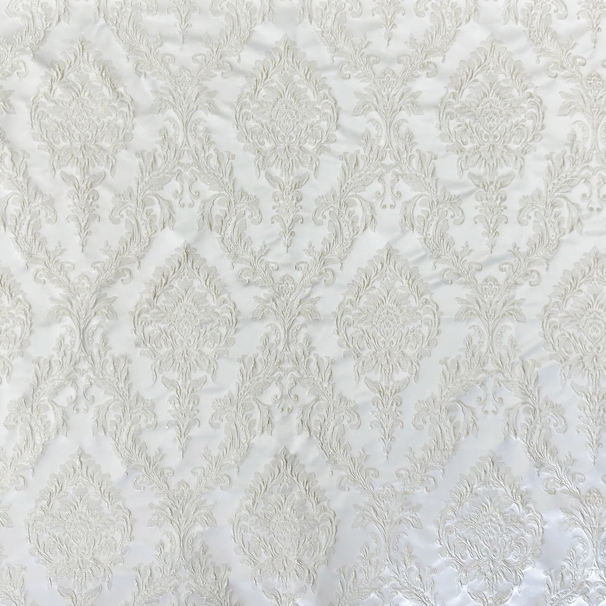 Perla fabric in color White showcasing fabric shiny floral damask jacquard drapery & curtain fabric.