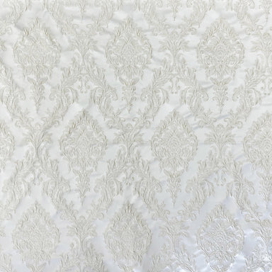 Perla fabric in color White showcasing fabric shiny floral damask jacquard drapery & curtain fabric.