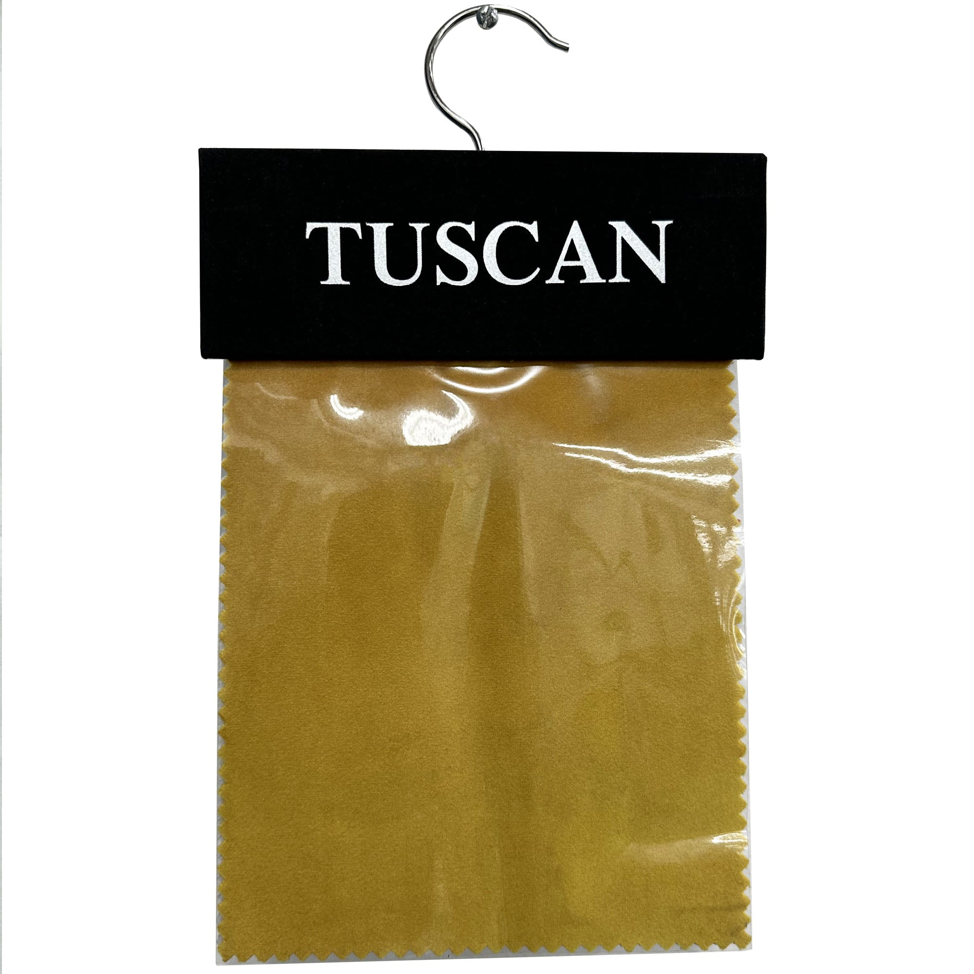 A sample of Tuscan solid shiny velvet fabric hanging from a hook, with a beige color tone.