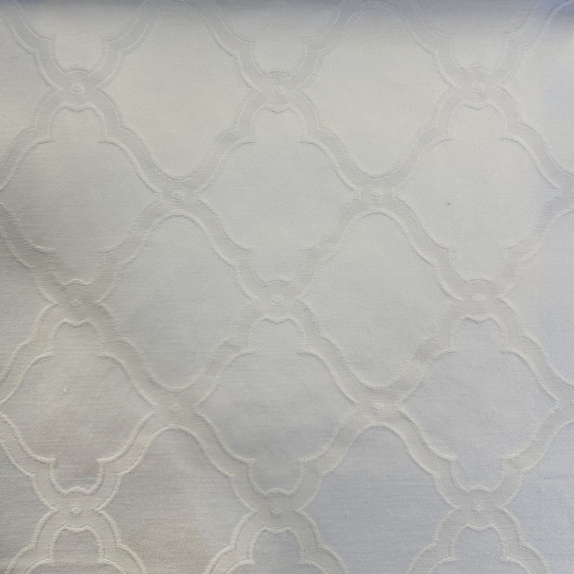 Serena fabric in color White showcasing fabric embossed diamond shaped geometric jacquard upholstery fabric & drapery & curtain fabric.