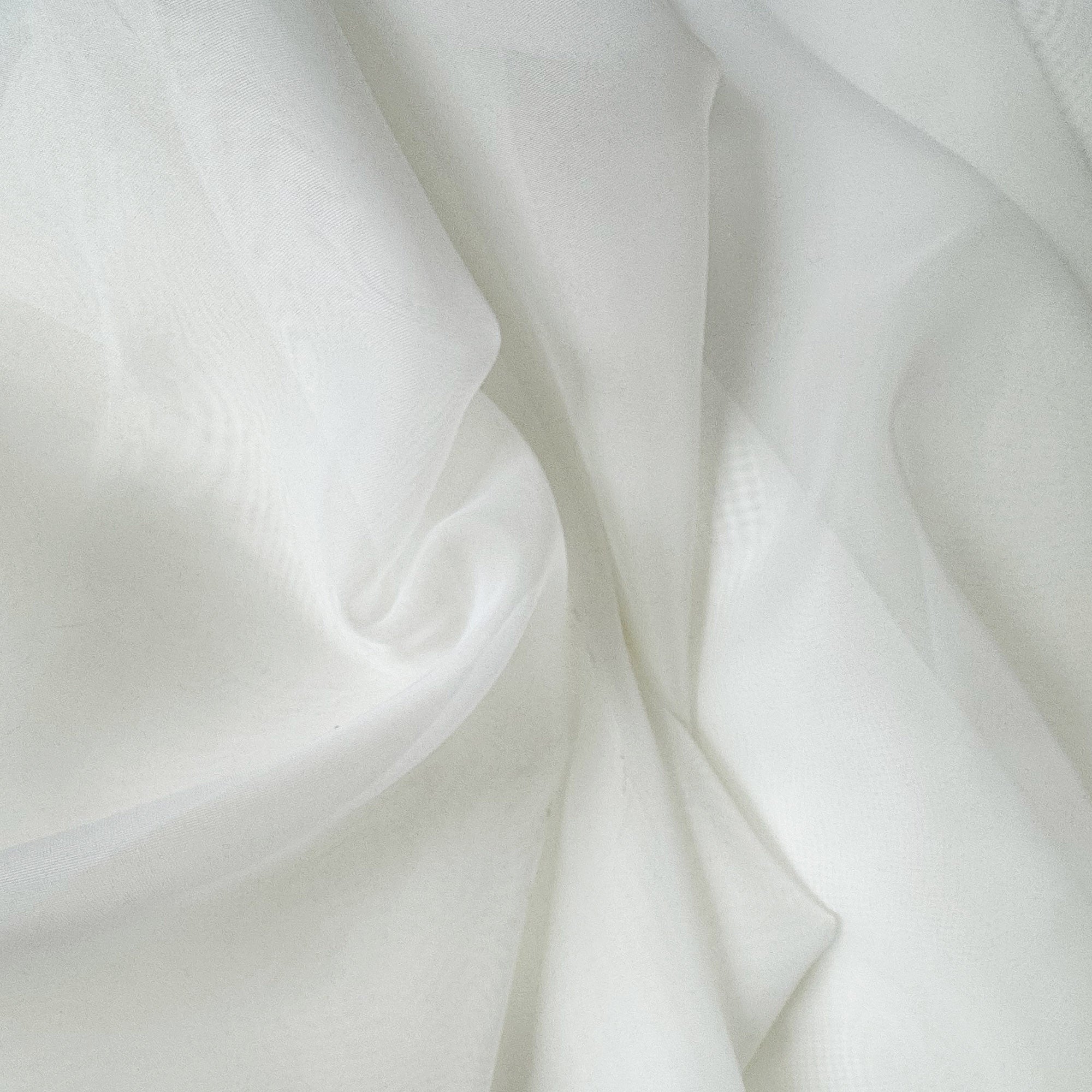 Voile fabric in color Ivory showcasing fabric sheer organza fabric drapery & curtain fabric.