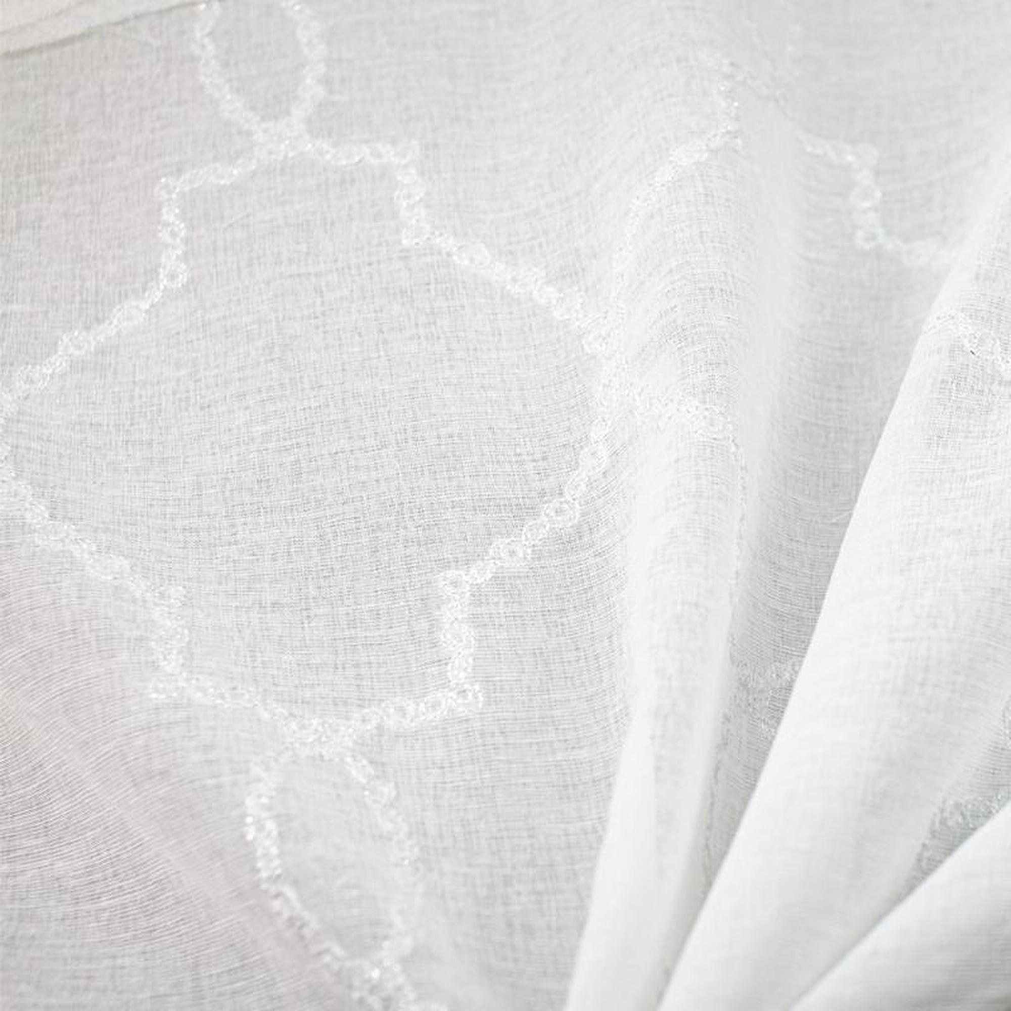 Aladdin fabric in color White showcasing fabric embroidered sheer drapery & curtain fabric.
