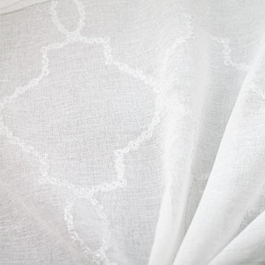 Aladdin fabric in color White showcasing fabric embroidered sheer drapery & curtain fabric.
