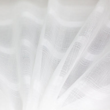 White lightweight sheer fabric with a refined texture, ideal for curtains and drapery. High-quality and stylish for any space.