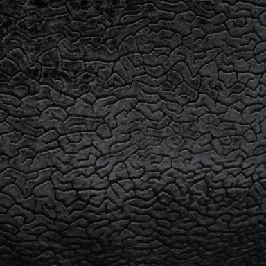Galil fabric in color Black showcasing fabric textured solid velvet upholstery fabric.