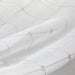 Cream lightweight sheer fabric with a refined texture, ideal for curtains and drapery. High-quality and stylish for any space.