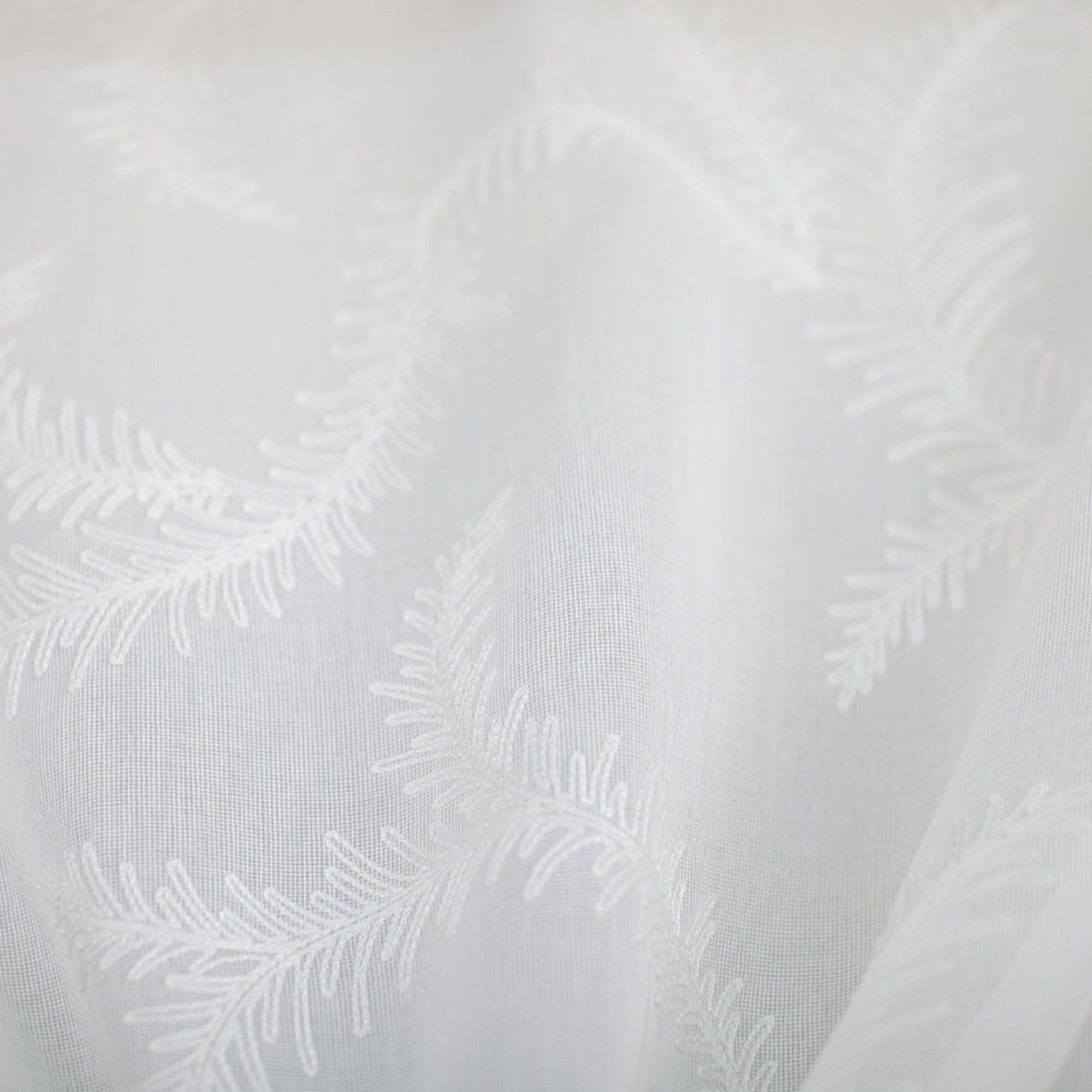 Karen fabric in color White showcasing fabric embroidered floral sheer drapery & curtain fabric.