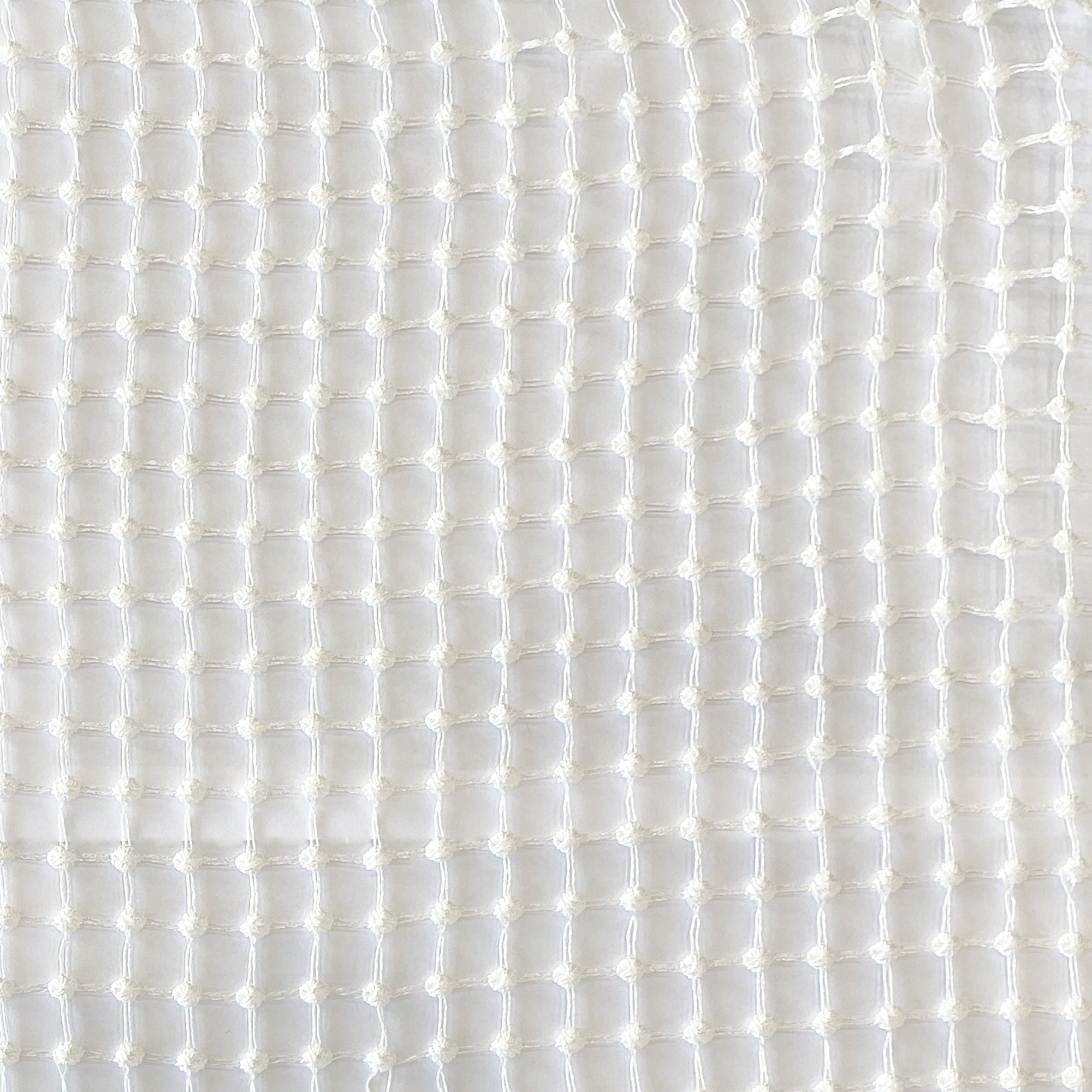 Netta fabric in color White showcasing fabric net like dotted sheer drapery & curtain fabric.