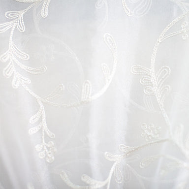 Park fabric in color White showcasing fabric floral embroidered metallic sheer drapery & curtain fabric.