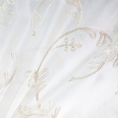 Park fabric in color Champagne showcasing fabric floral embroidered metallic sheer drapery & curtain fabric.