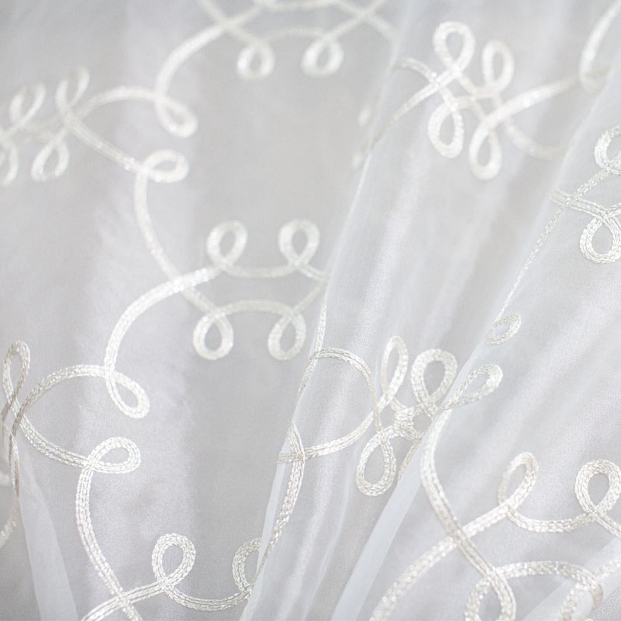Uptown fabric in color White showcasing fabric metallic embroidered sheer drapery & curtain fabric.
