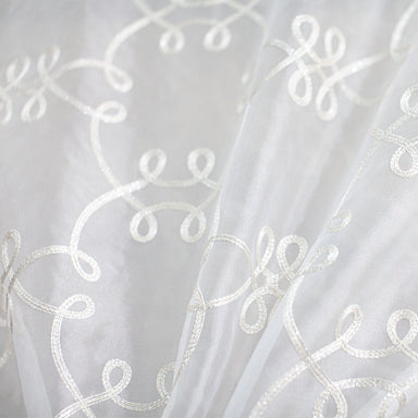 Uptown fabric in color White showcasing fabric metallic embroidered sheer drapery & curtain fabric.