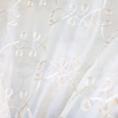 Uptown fabric in color Champagne showcasing fabric metallic embroidered sheer drapery & curtain fabric.