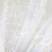 Uptown fabric in color Champagne showcasing fabric metallic embroidered sheer drapery & curtain fabric.