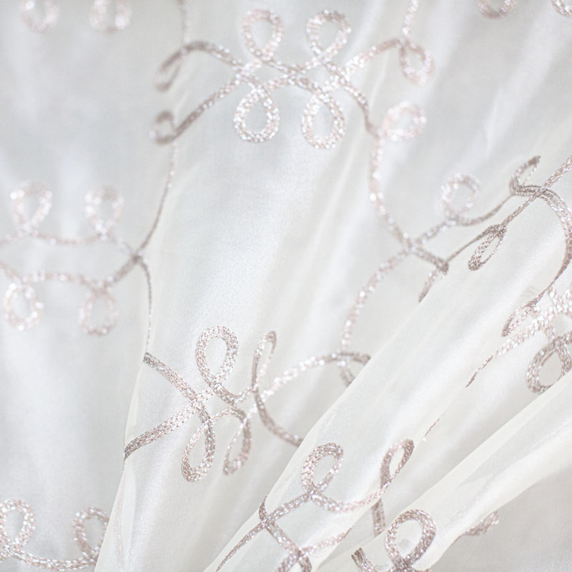 Uptown fabric in color Brass showcasing fabric metallic embroidered sheer drapery & curtain fabric.