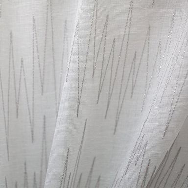 Zeek fabric in color Silver showcasing fabric zig zag metallic embroidered sheer drapery & curtain fabric.