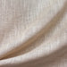 Zeil fabric in color Beige showcasing fabric solid metallic thread sheer drapery & curtain fabric.